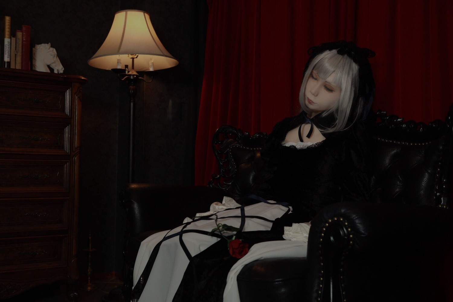 1girl black_dress book chair choker closed_eyes curtains dress flower gothic_lolita lolita_fashion red_flower red_rose rose sitting solo suigintou