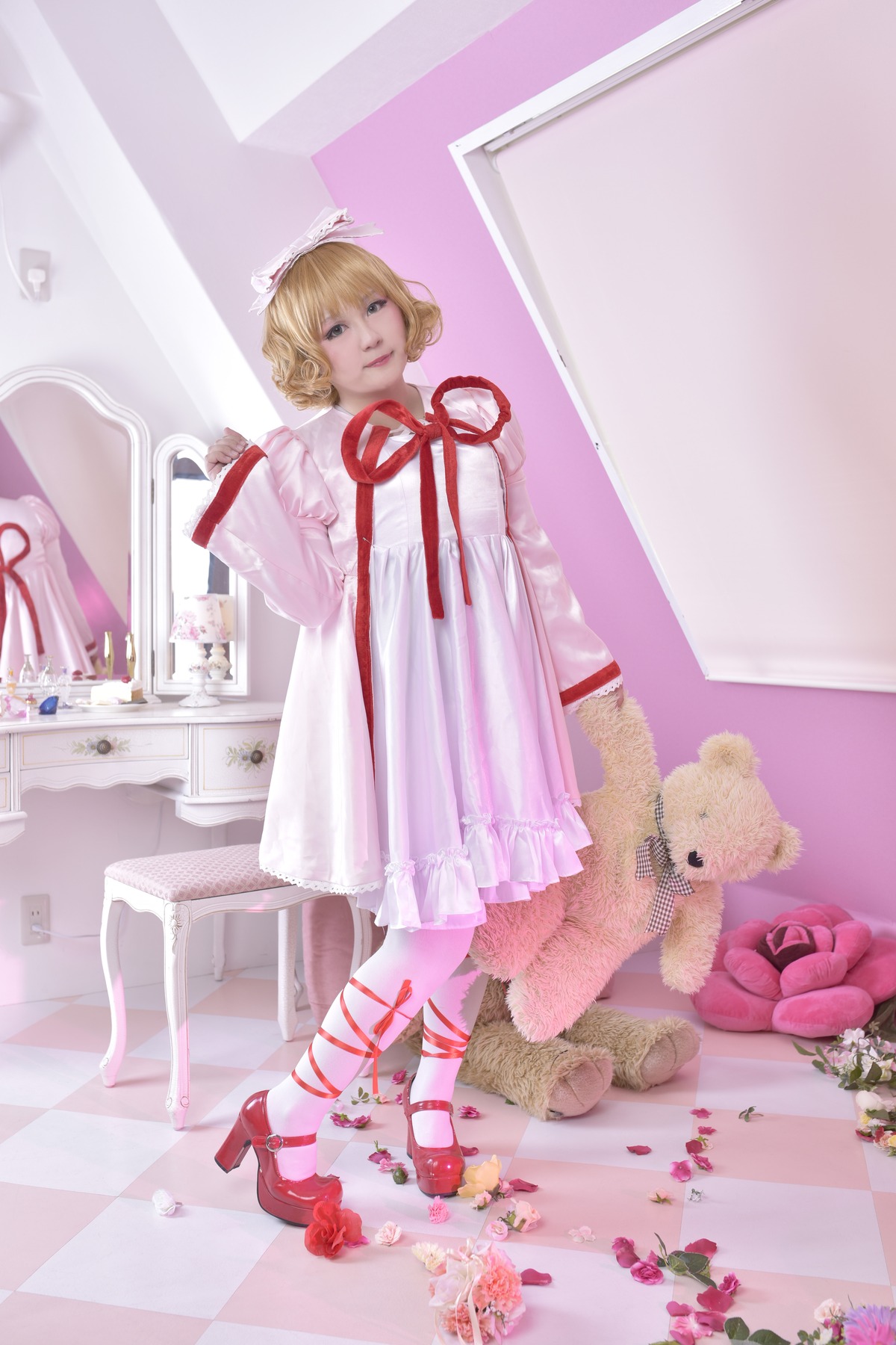 1girl argyle blonde_hair blue_eyes checkered checkered_background checkered_floor curly_hair dress flower full_body high_heels hinaichigo pink_dress red_footwear red_ribbon ribbon rose short_hair solo standing stuffed_animal teddy_bear tile_floor tiles