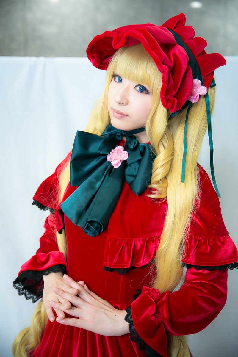 1girl blonde_hair blue_eyes bonnet bow dress drill_hair flower frills hands_together hat lips long_hair long_sleeves looking_at_viewer own_hands_together photo realistic red_dress rose shinku solo