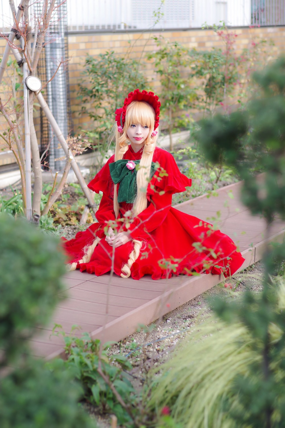 1girl blonde_hair blue_eyes blurry depth_of_field dress flower photo shinku sitting solo