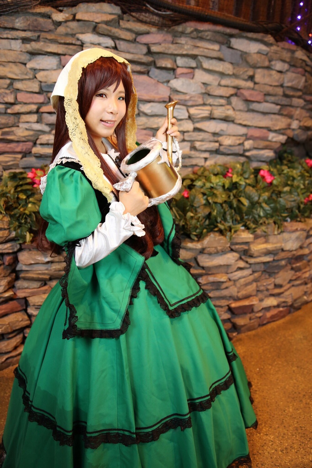 1girl brown_hair cup dress green_dress long_sleeves smile solo suiseiseki