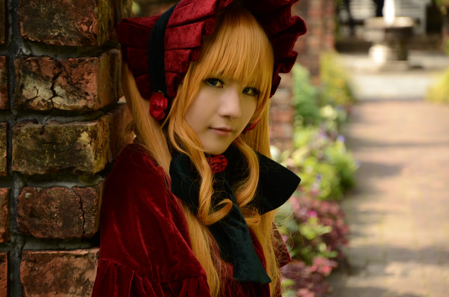 1girl bangs blonde_hair blurry blurry_background bonnet depth_of_field flower lips long_hair looking_at_viewer red_flower red_rose rose shinku solo upper_body