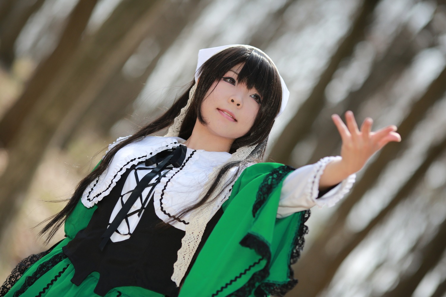 1girl bangs black_hair black_ribbon blurry blurry_background depth_of_field dress frills green_dress lips long_hair long_sleeves looking_at_viewer ribbon solo suiseiseki