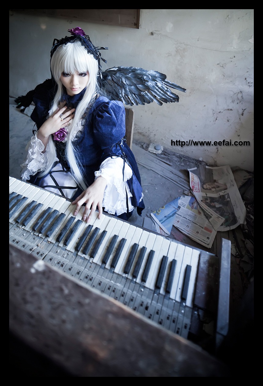 1girl black_border dress electric_guitar feathers flower guitar instrument keyboard_(instrument) letterboxed lips long_hair music piano rose sheet_music silver_hair sitting solo suigintou wings