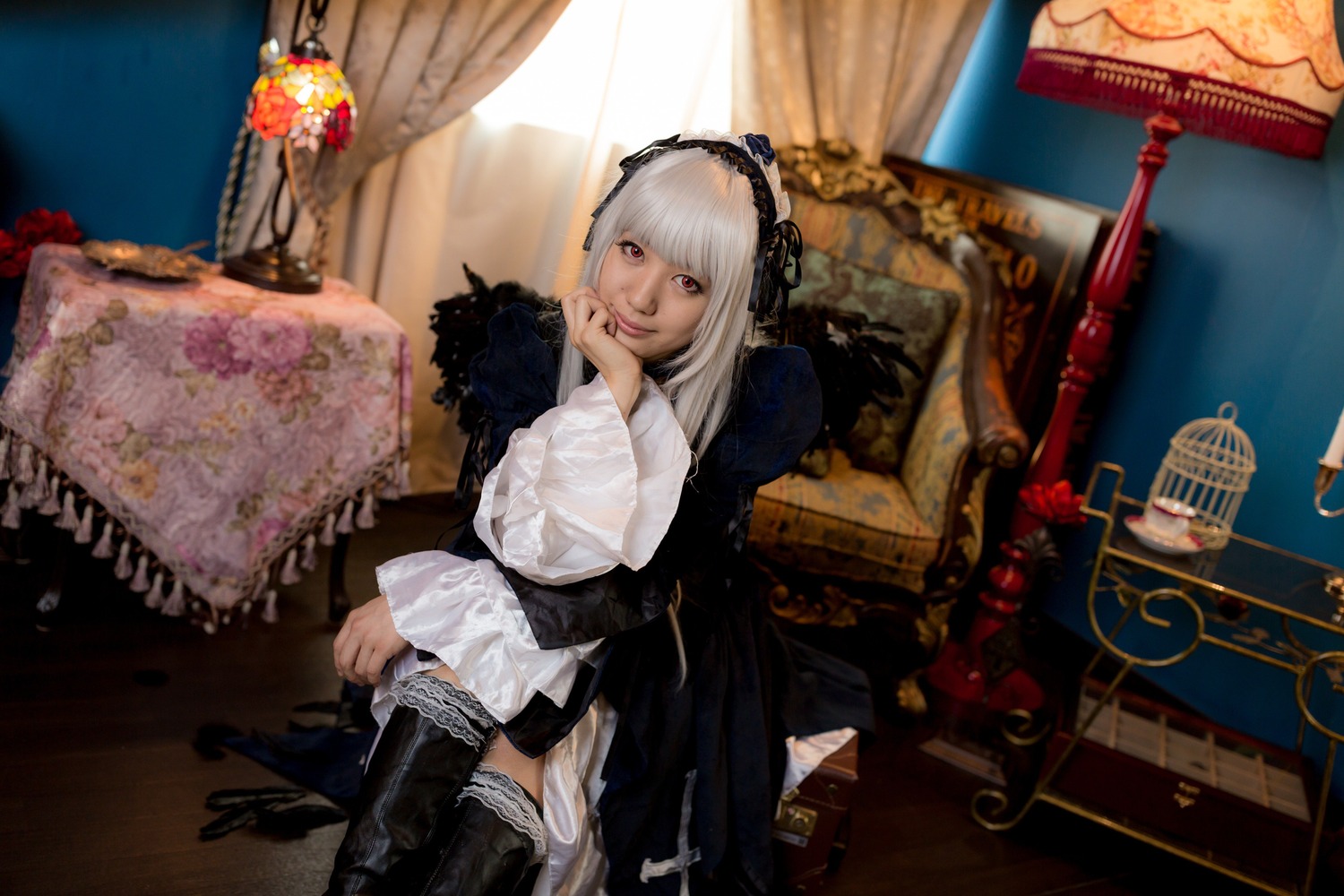 1girl 3d boots curtains flower hairband indoors lolita_fashion long_sleeves looking_at_viewer pillow red_eyes sitting solo suigintou thigh_boots thighhighs white_hair