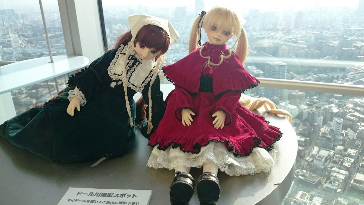 2girls blonde_hair bonnet brown_hair capelet doll dress long_hair long_sleeves looking_at_viewer multiple_dolls multiple_girls red_dress sitting standing tagme twins twintails