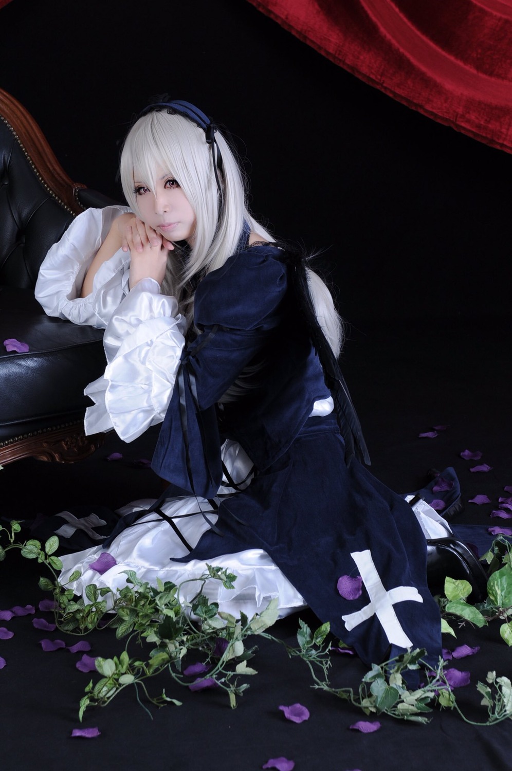 1girl black_dress curtains dress flower frills hairband long_hair long_sleeves looking_at_viewer petals sitting solo suigintou white_hair