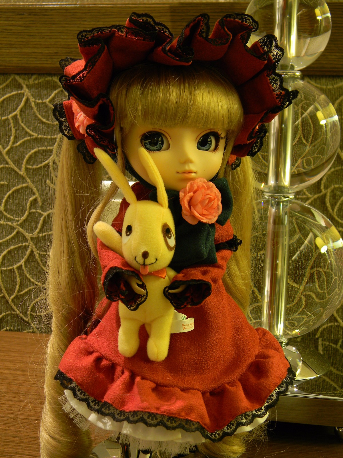 1girl blonde_hair blue_eyes bow doll dress flower long_hair red_dress rose shinku solo stuffed_animal