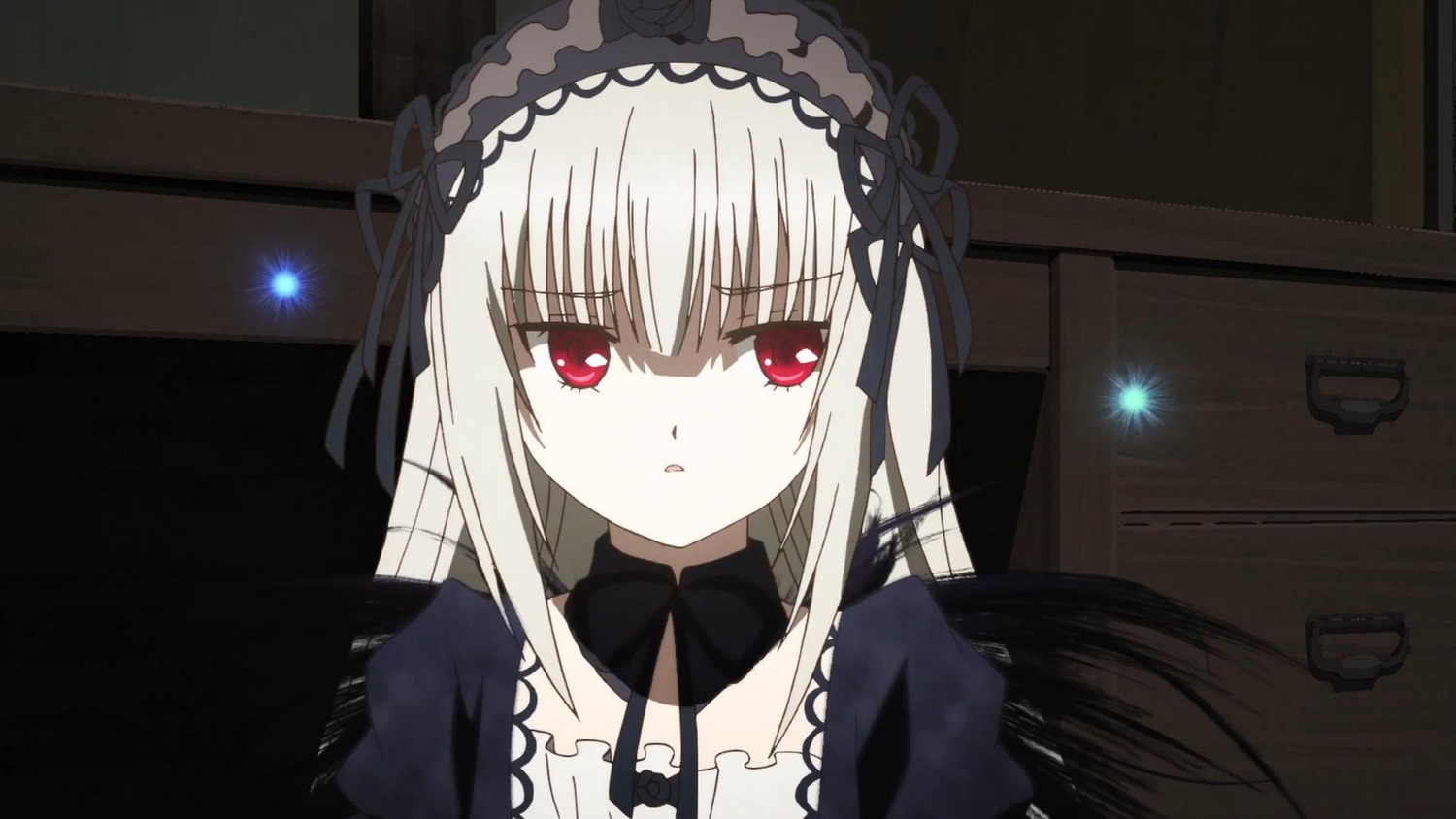 1girl bangs black_dress black_ribbon black_wings detached_collar dress eyebrows_visible_through_hair hair_between_eyes hairband image indoors long_hair looking_at_viewer parted_lips red_eyes ribbon silver_hair solo suigintou wings