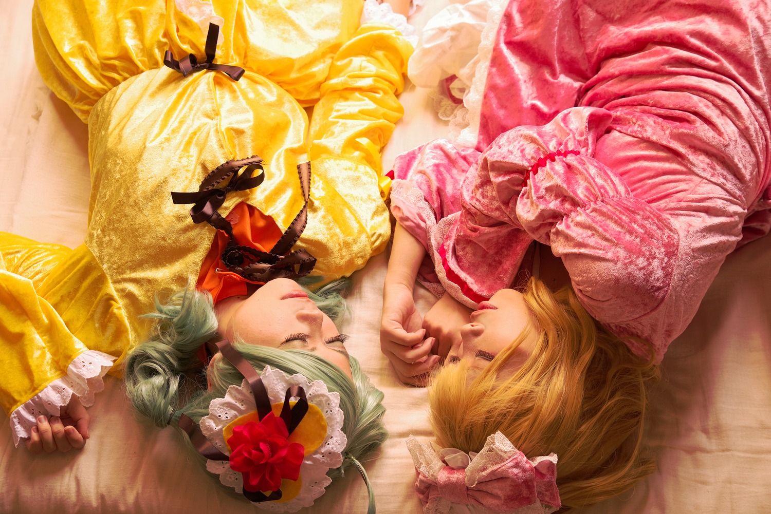 2girls blonde_hair closed_eyes flower green_hair hair_flower hair_ornament lying multiple_cosplay multiple_girls on_side realistic sleeping tagme