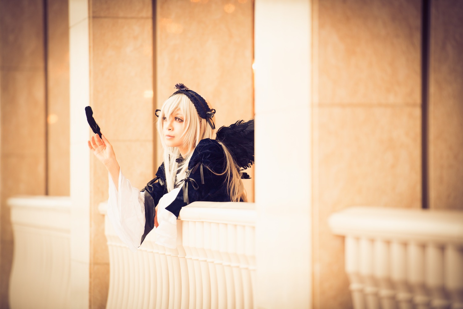 1girl bird blurry blurry_background blurry_foreground depth_of_field indoors long_hair photo sitting solo suigintou