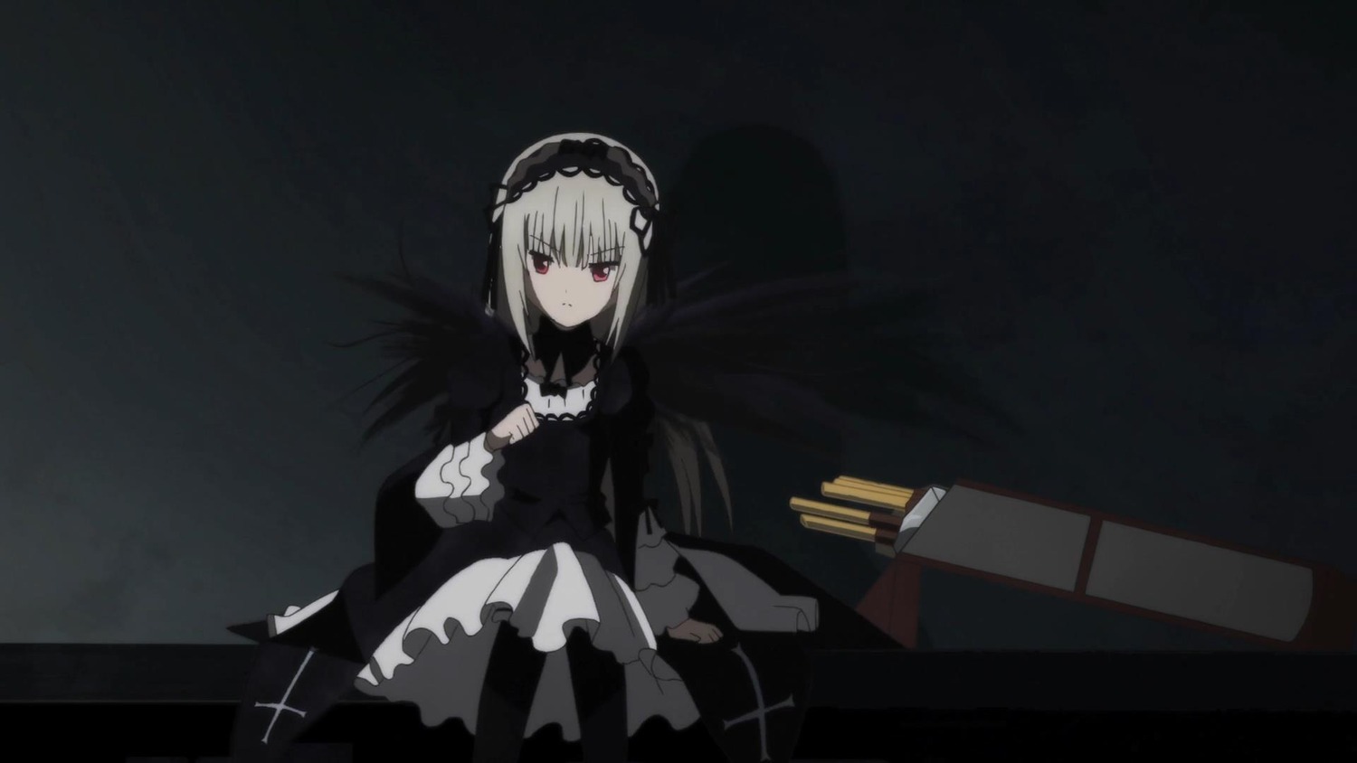 1girl black_background black_dress closed_mouth dress frills hairband image long_hair long_sleeves looking_at_viewer red_eyes ribbon silver_hair sitting solo suigintou