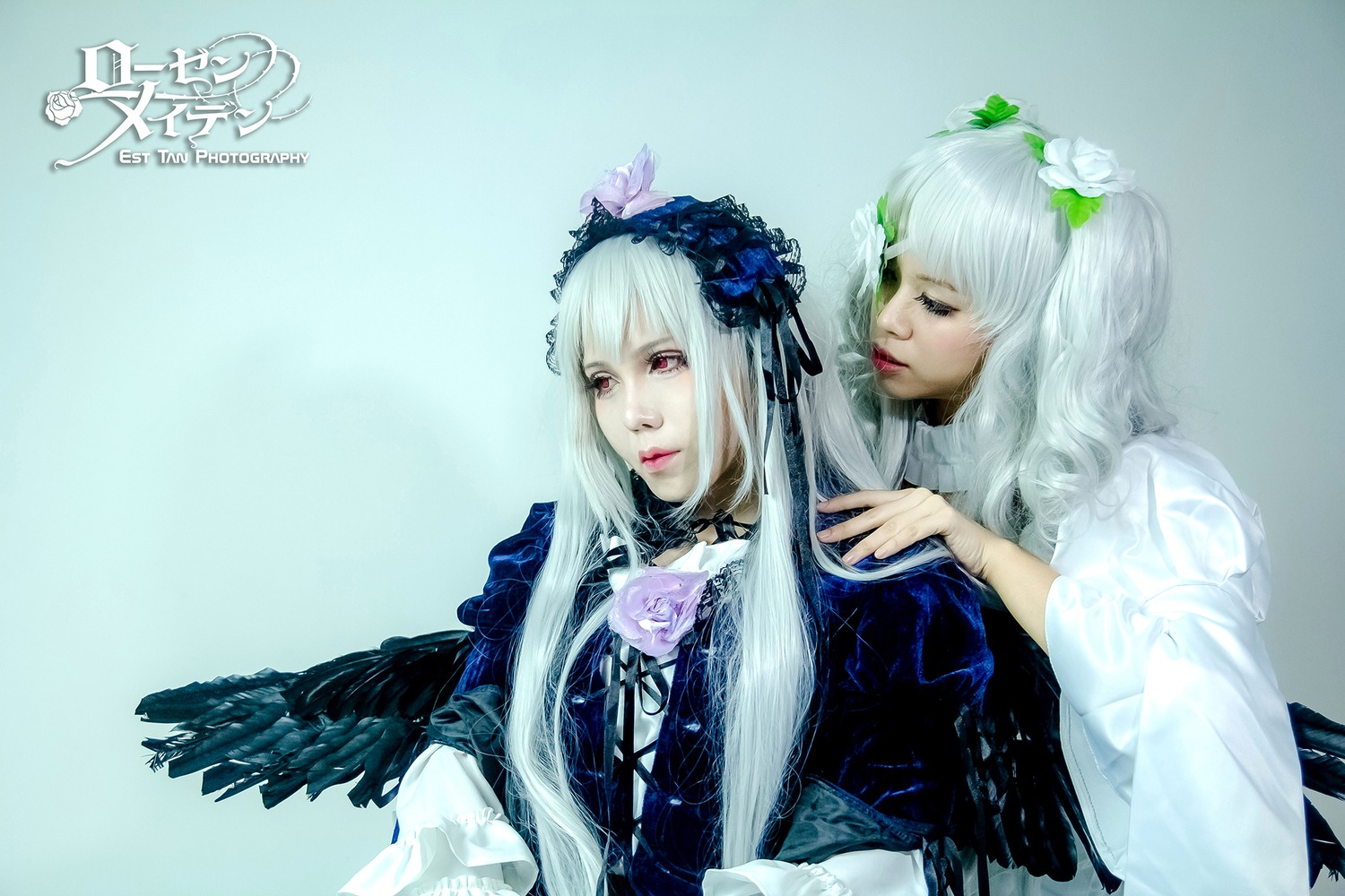 2girls black_wings flower hair_ornament lips long_hair multiple_cosplay multiple_girls realistic red_eyes ribbon sisters suigintou tagme wings