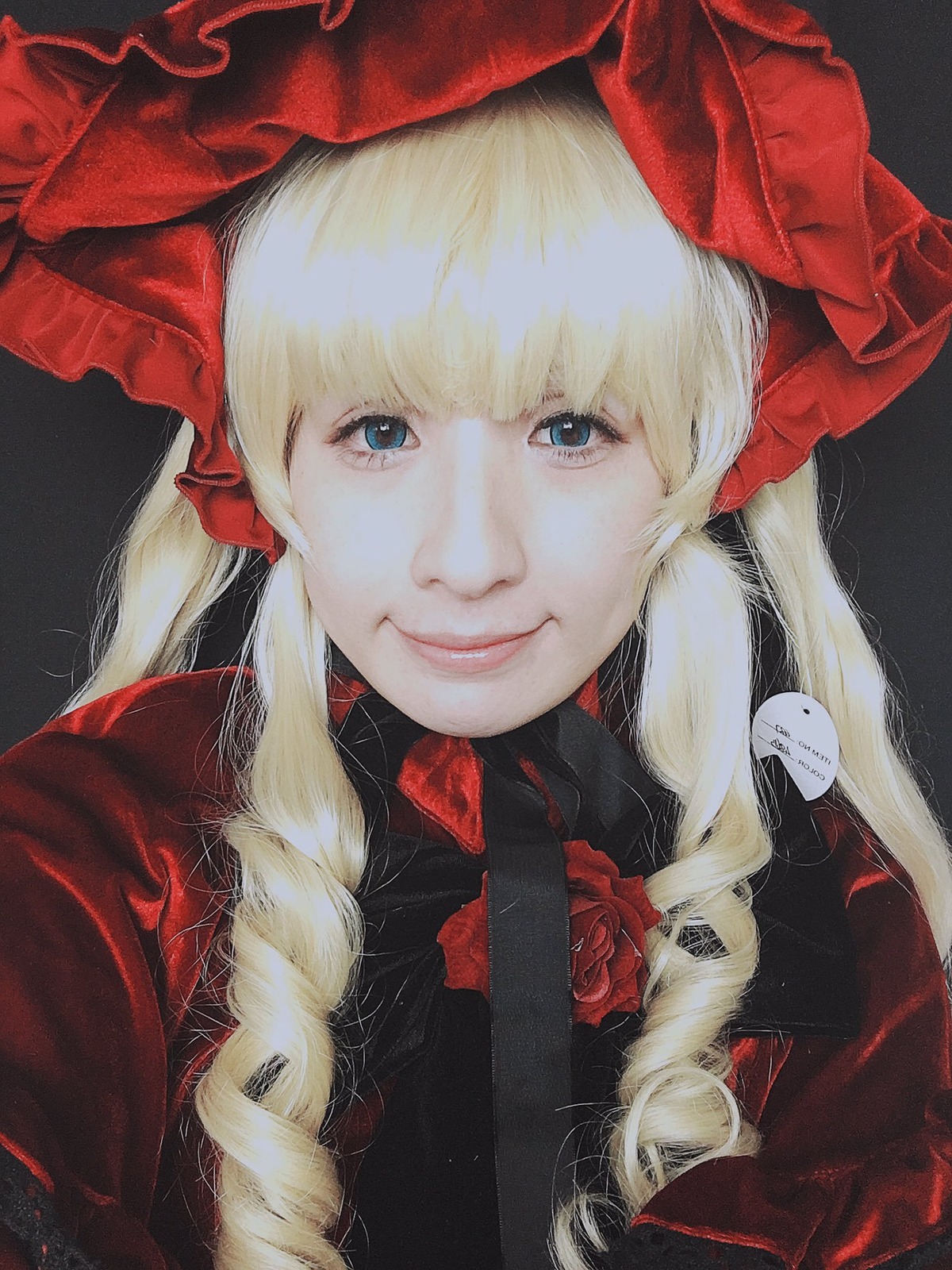 1girl bangs black_background blonde_hair blue_eyes bow closed_mouth flower lips long_hair looking_at_viewer portrait red_flower red_rose rose shinku simple_background smile solo traditional_media upper_body