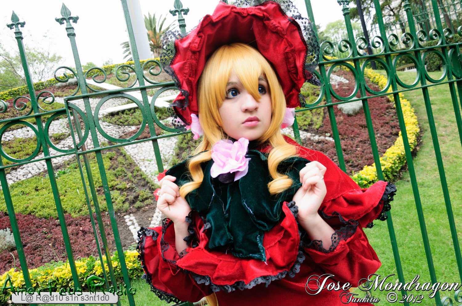 1girl blonde_hair blue_eyes bonnet bush dress fence flower food frills garden looking_at_viewer pink_rose plant red_dress rose shinku solo upper_body watermark