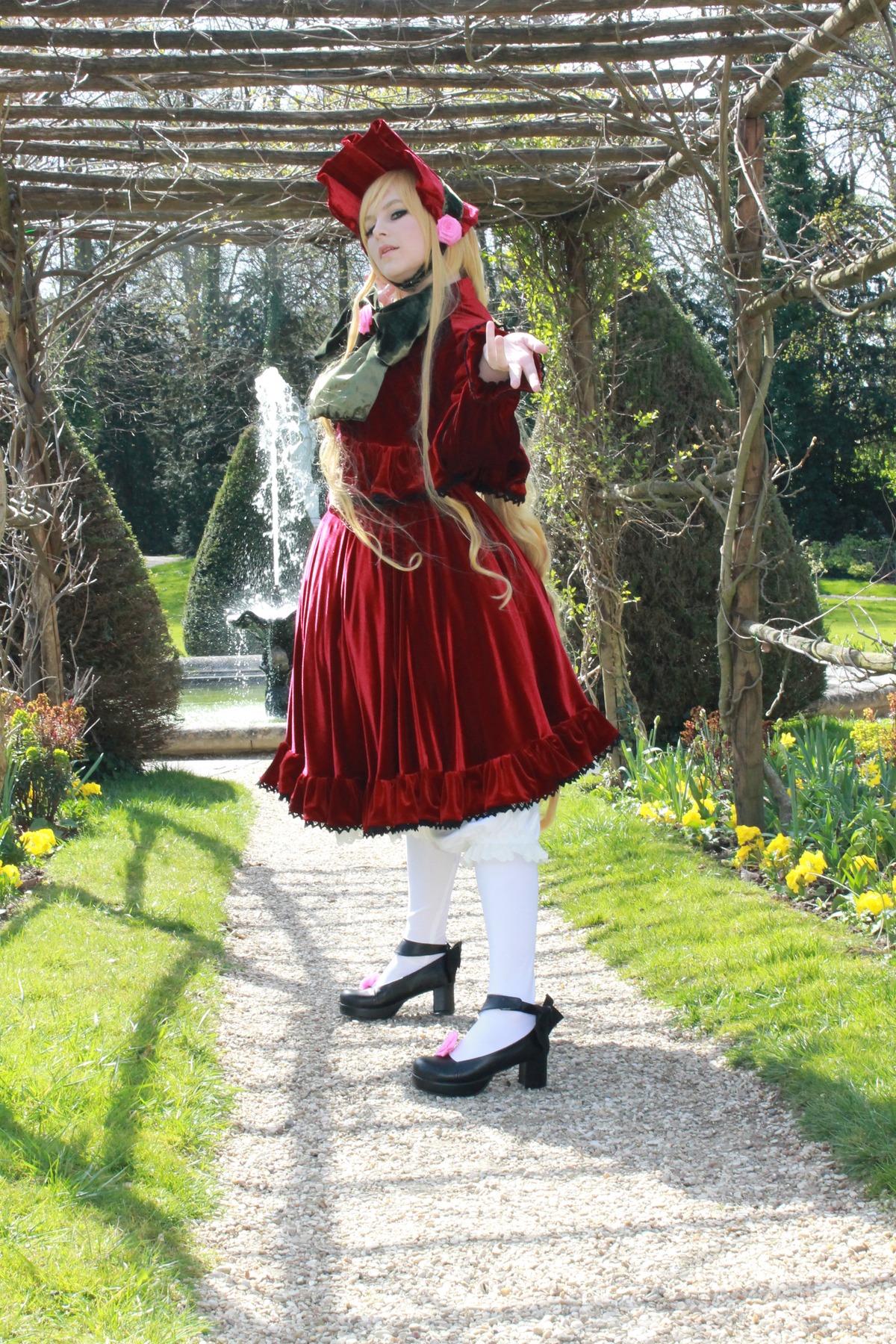 1girl auto_tagged blonde_hair bonnet bow dress flower grass long_hair nature outdoors pantyhose red_dress shinku shoes solo standing tree white_legwear