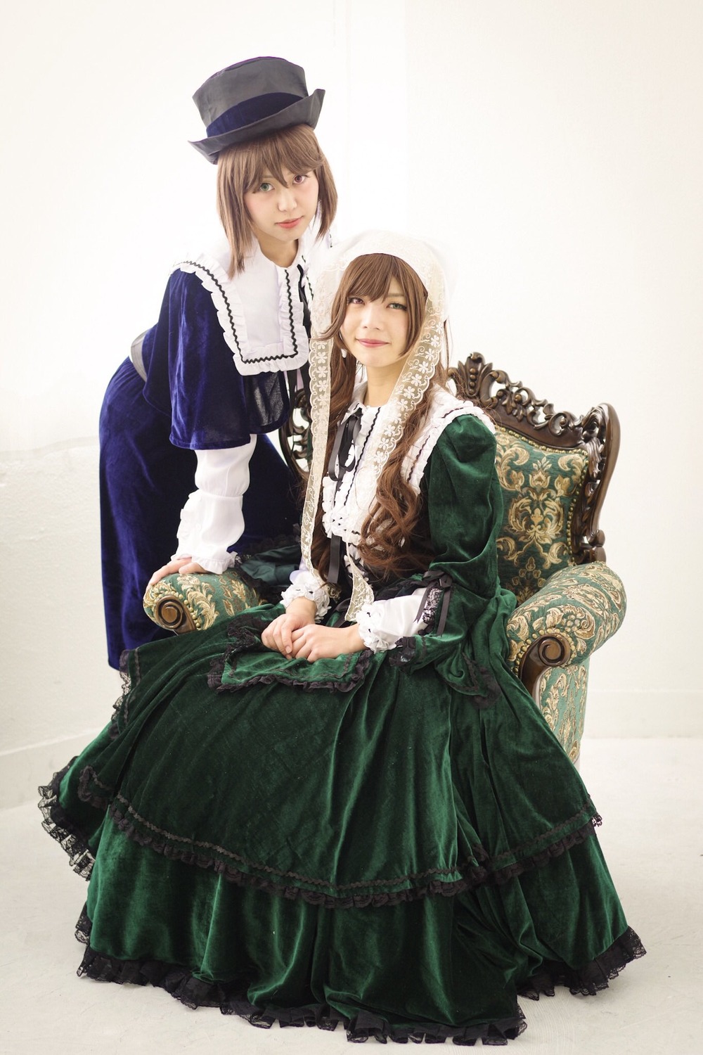 blonde_hair brown_hair dress frills green_dress hat multiple_cosplay siblings sisters sitting tagme top_hat twins