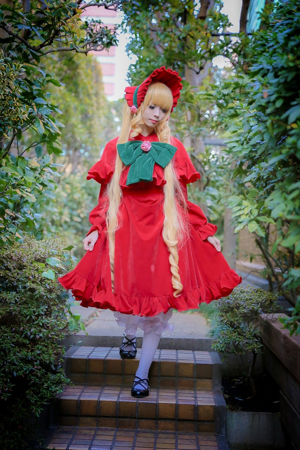 1girl blonde_hair bonnet bow bush dress frills long_sleeves outdoors pantyhose plant red_dress shinku shoes solo standing tree white_legwear