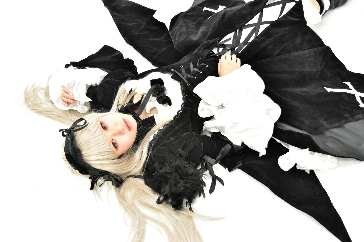 1girl black_dress black_ribbon black_wings closed_mouth detached_collar dress flower frills hairband long_hair long_sleeves looking_at_viewer ribbon rose simple_background solo suigintou very_long_hair white_background wings