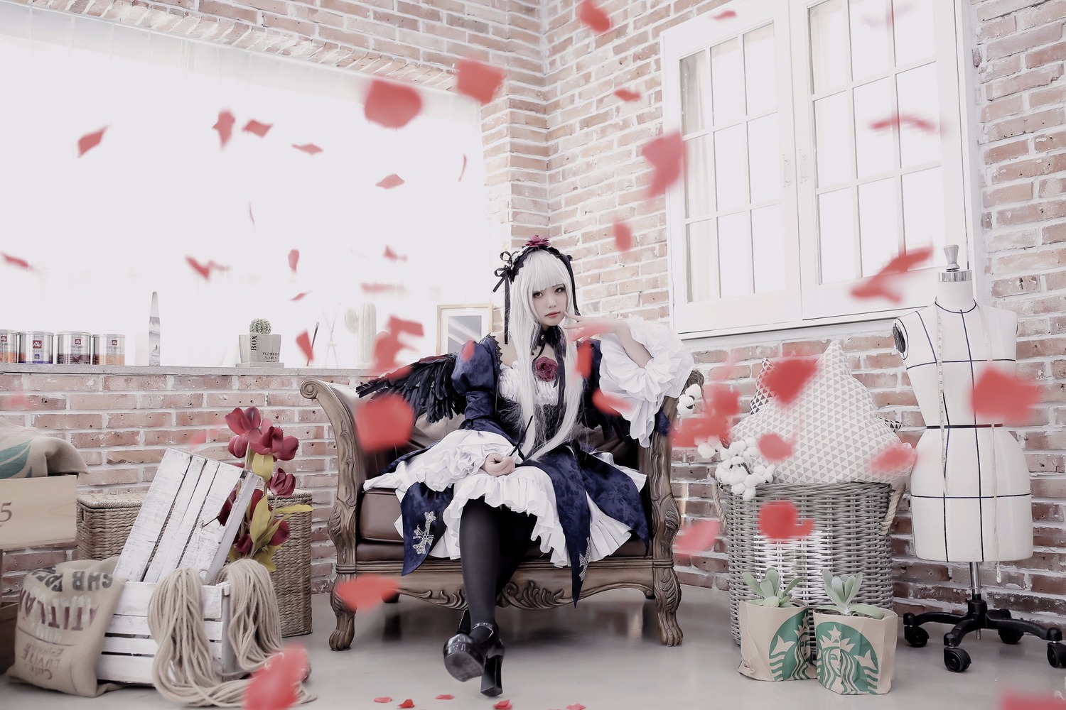 1girl black_legwear boots dress long_hair petals rifle silver_hair sitting solo suigintou