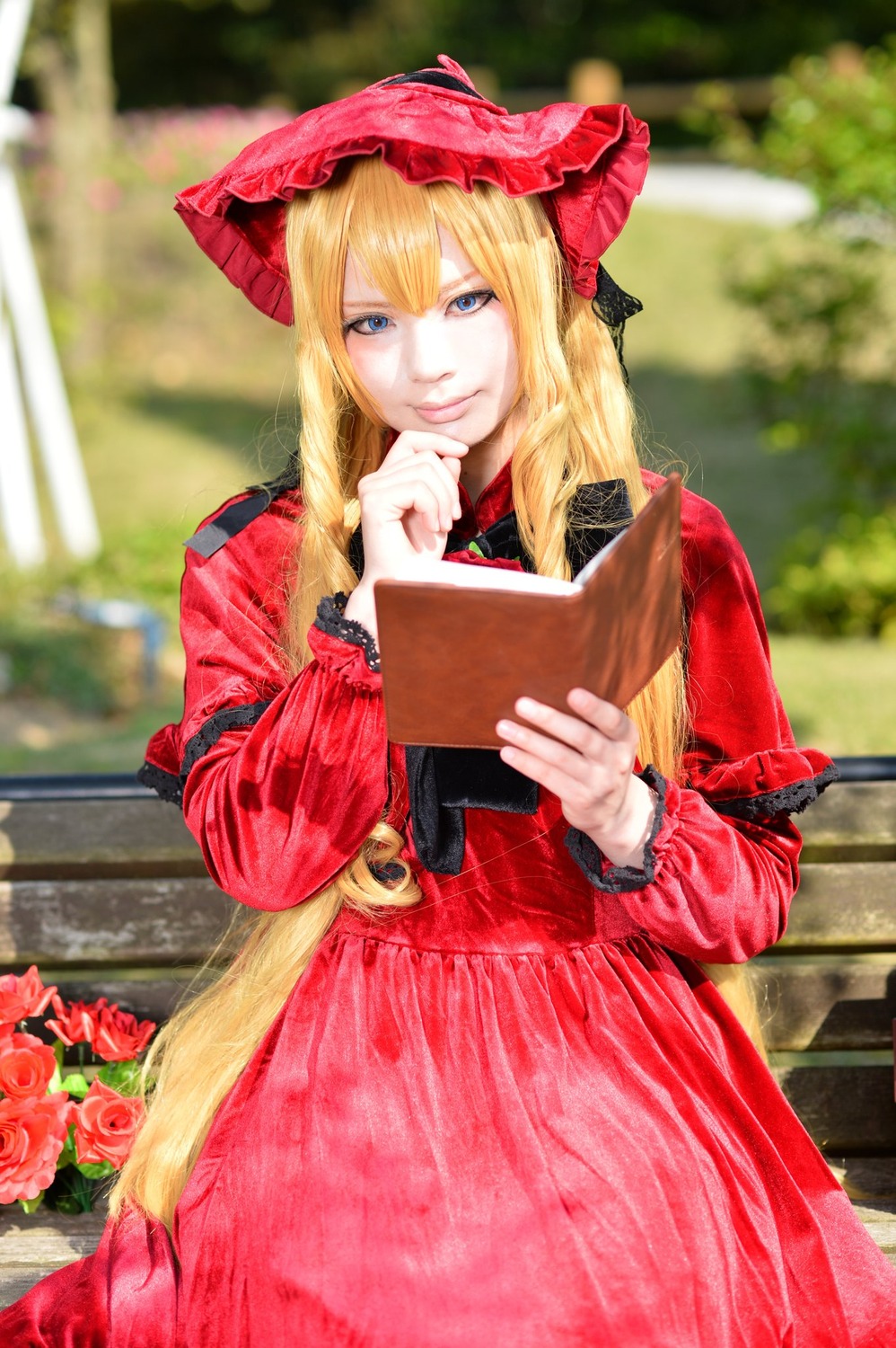 1girl blonde_hair blue_eyes blurry blurry_background depth_of_field dress flower long_hair long_sleeves looking_at_viewer outdoors pink_flower pink_rose red_dress red_flower red_rose rose shinku solo