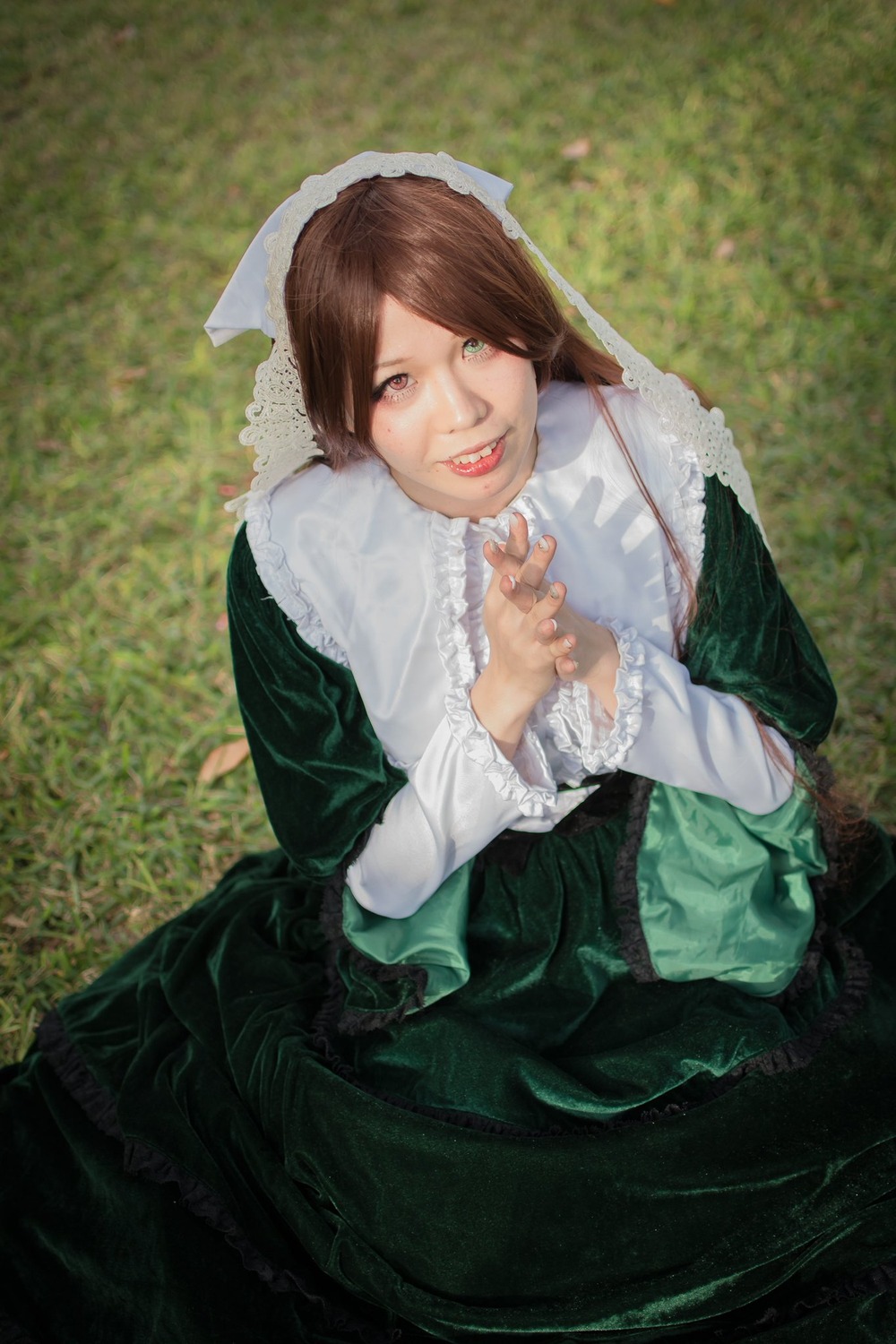 1girl brown_eyes brown_hair dress frills green_dress lips long_hair long_sleeves looking_at_viewer outdoors smile solo suiseiseki