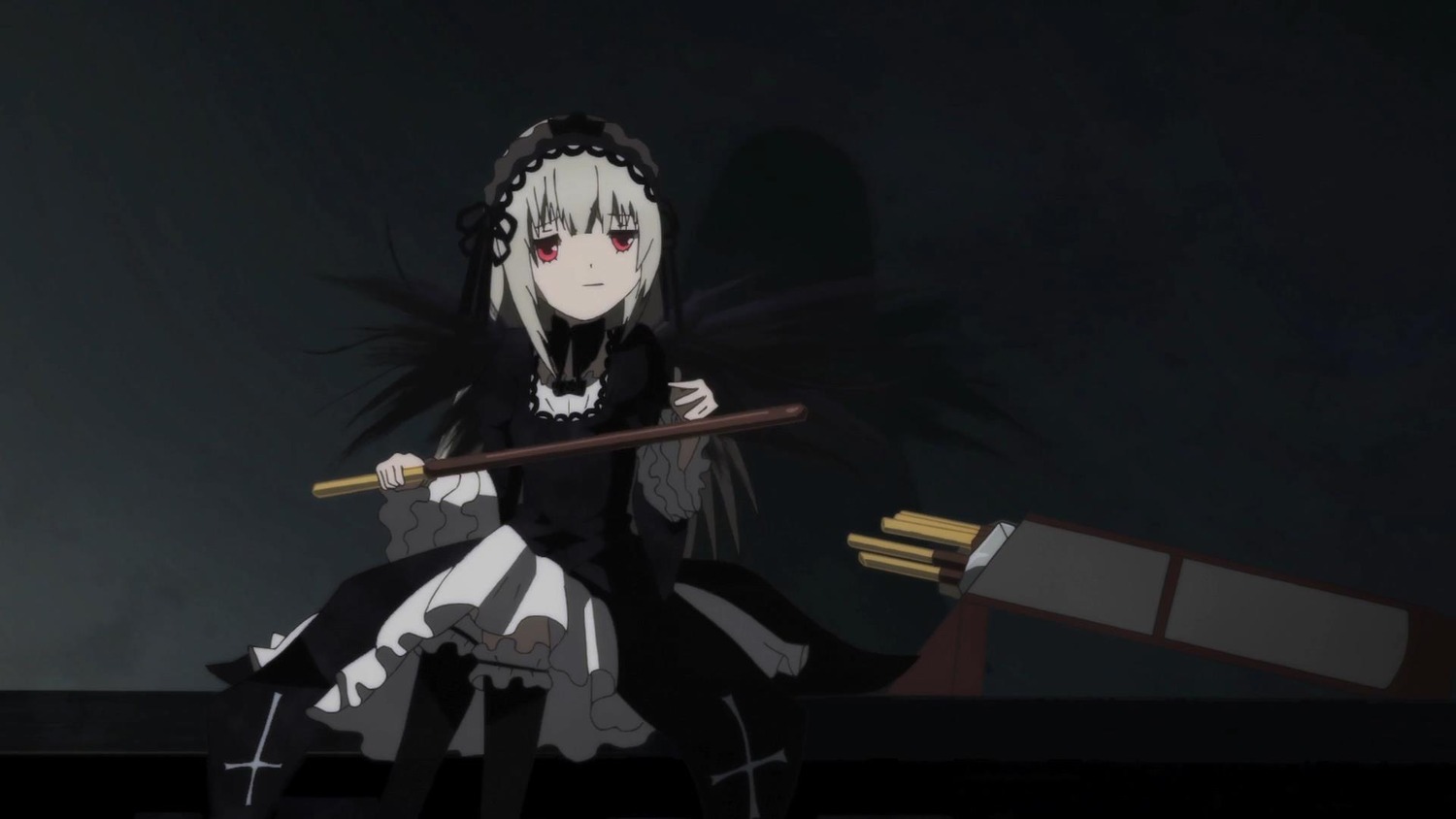 1girl bangs black_background black_dress black_legwear closed_mouth dress frills gothic_lolita hairband holding holding_weapon image lolita_fashion long_sleeves looking_at_viewer red_eyes silver_hair sitting solo suigintou weapon