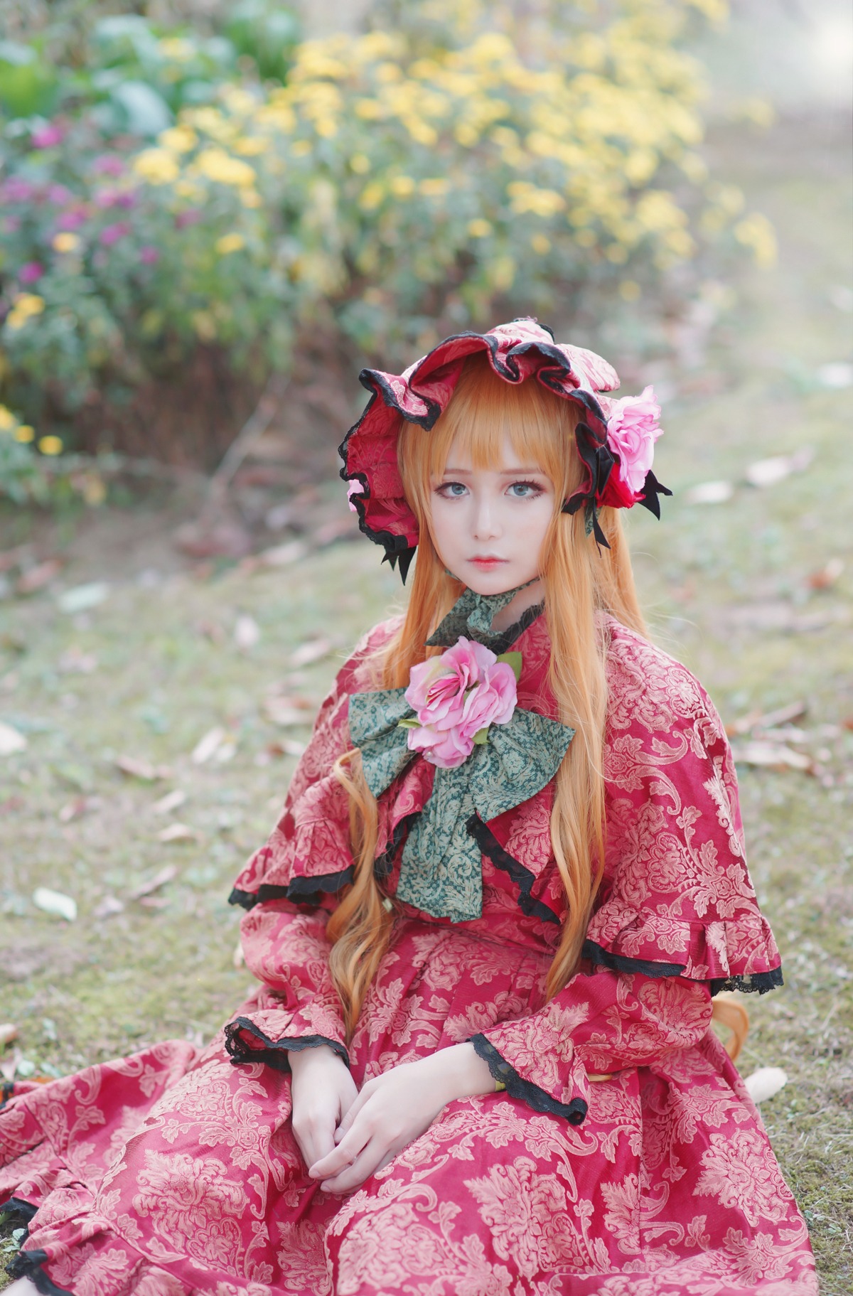 1girl blonde_hair blue_eyes blurry blurry_background depth_of_field floral_print flower japanese_clothes lips long_hair looking_at_viewer shinku sitting solo