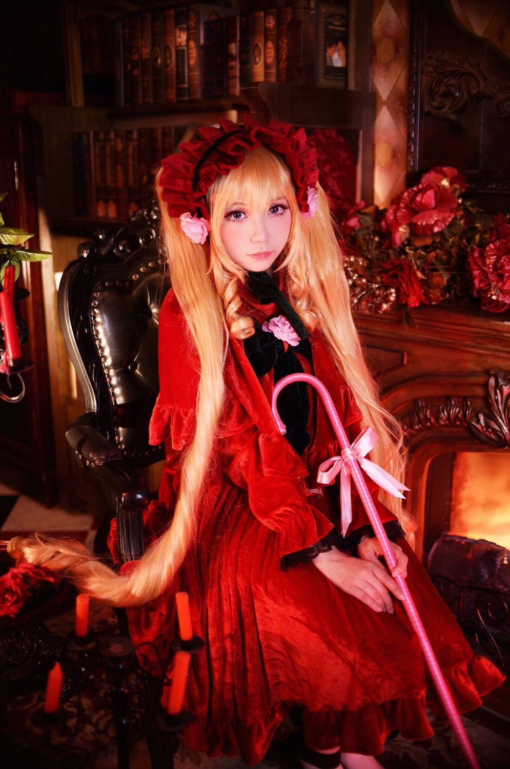 1girl blonde_hair blue_eyes bookshelf chair dress flower gothic_lolita lolita_fashion long_hair looking_at_viewer red_dress rose shinku sitting solo twintails