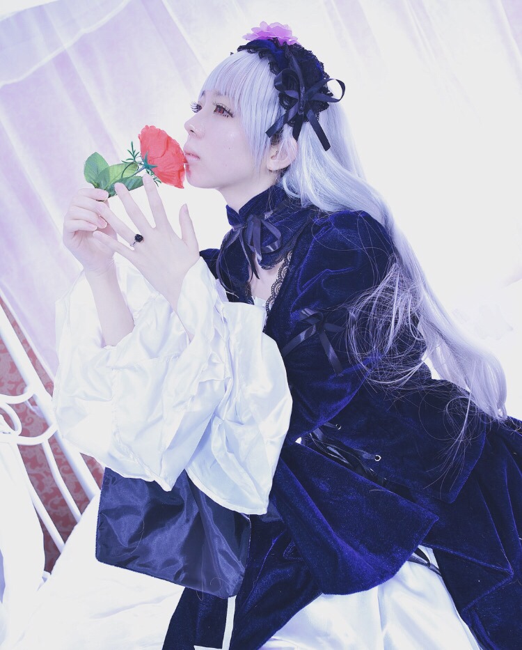 1girl bangs dress flower frills hairband half-closed_eyes holding lips long_hair long_sleeves nail_polish profile ribbon sitting solo suigintou white_hair