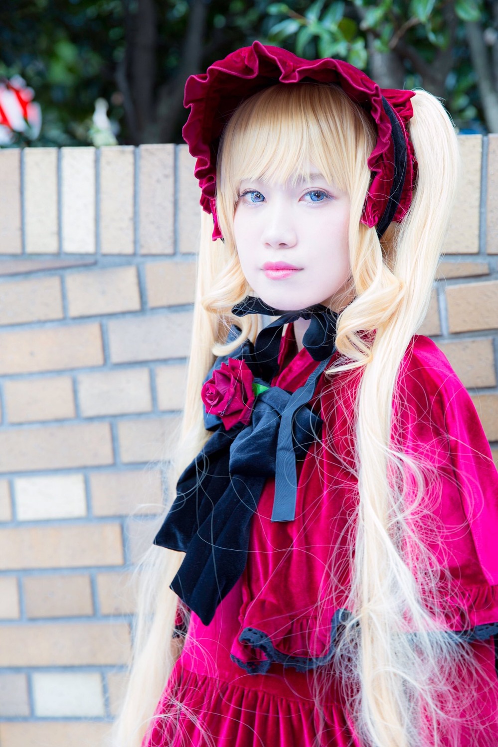 1girl blonde_hair blue_eyes blurry blurry_background depth_of_field dress flower lips long_hair looking_at_viewer photo red_flower red_rose rose shinku solo