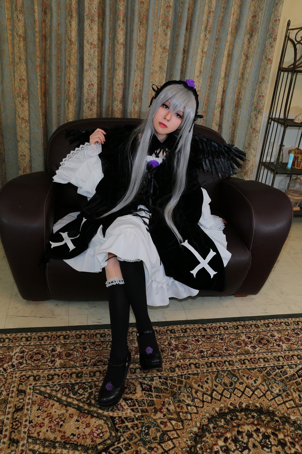 1girl black_legwear dress frills gothic_lolita lolita_fashion long_hair silver_hair sitting solo suigintou wings