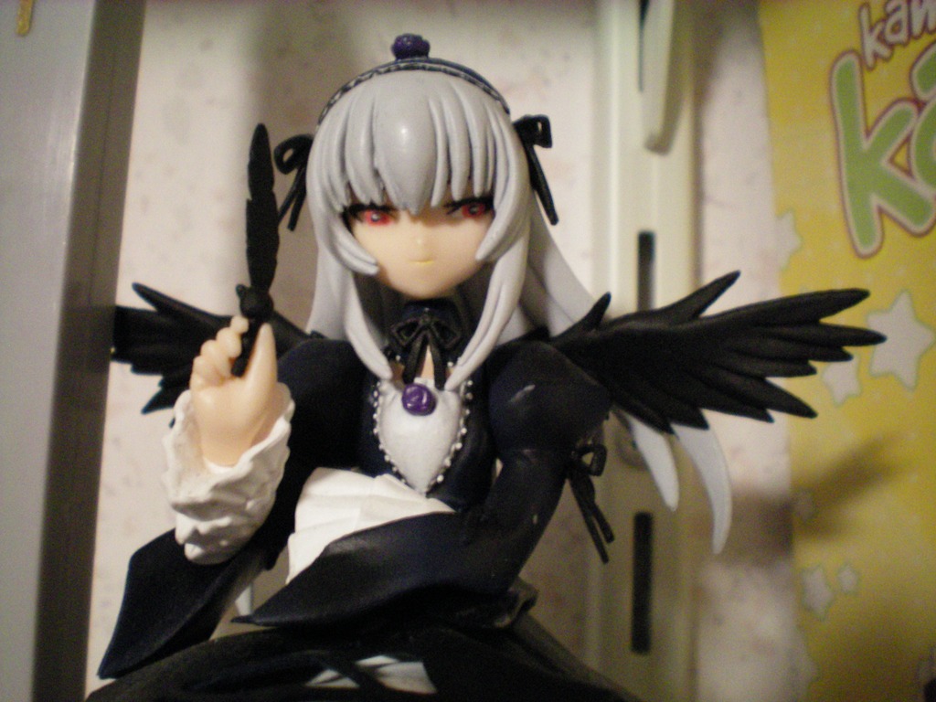 1girl bangs black_wings doll dress feathered_wings feathers frills hairband long_hair long_sleeves looking_at_viewer photo red_eyes ribbon rose silver_hair solo suigintou upper_body wings