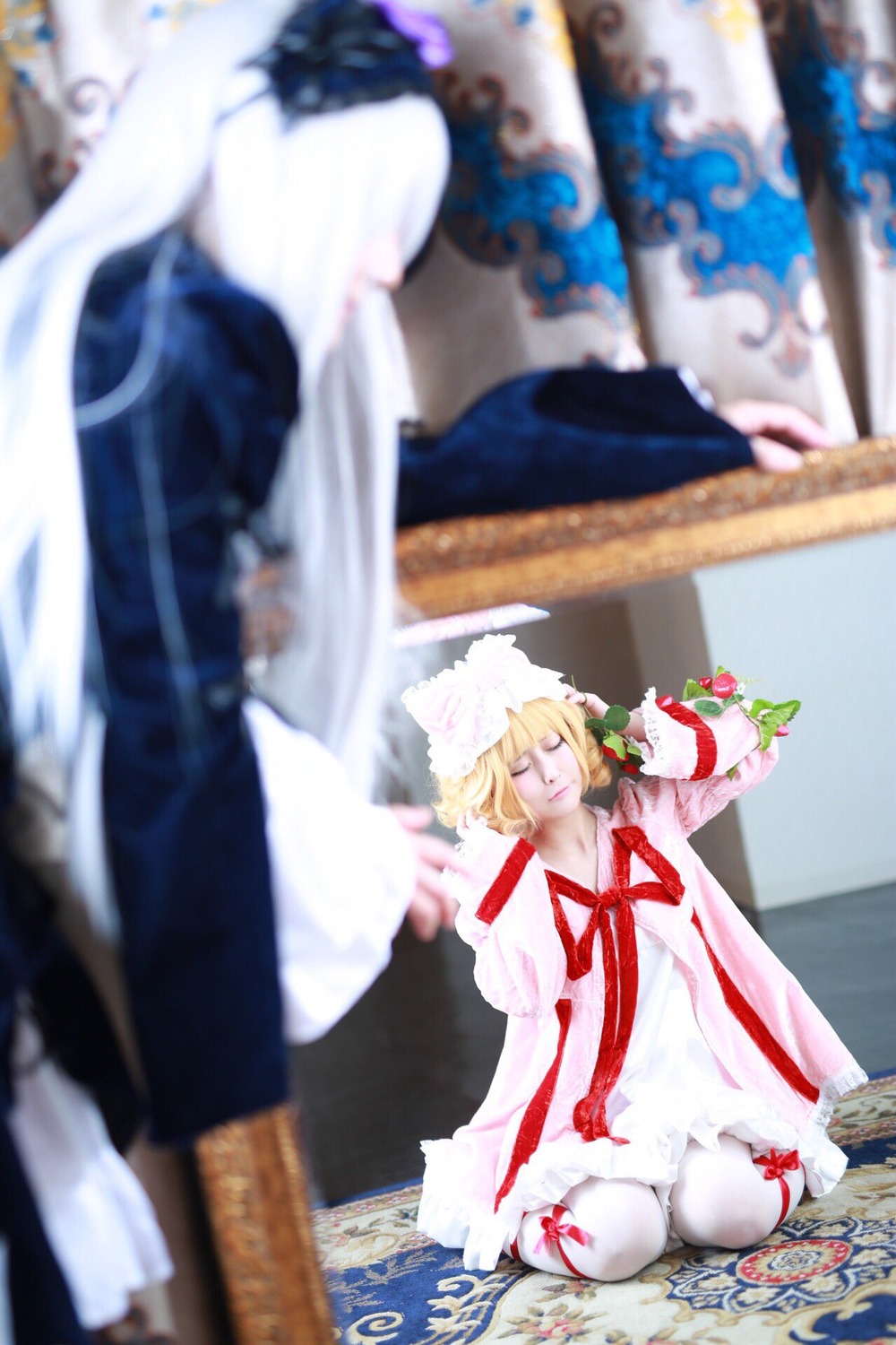 blonde_hair blurry blurry_background blurry_foreground bouquet closed_eyes depth_of_field dress flower frills indoors motion_blur multiple_cosplay photo ribbon sitting tagme wariza white_dress