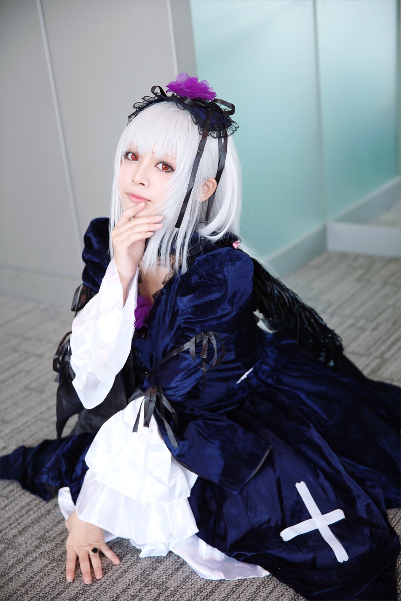 1girl bangs dress flower hairband indoors long_hair long_sleeves looking_at_viewer red_eyes sitting solo suigintou