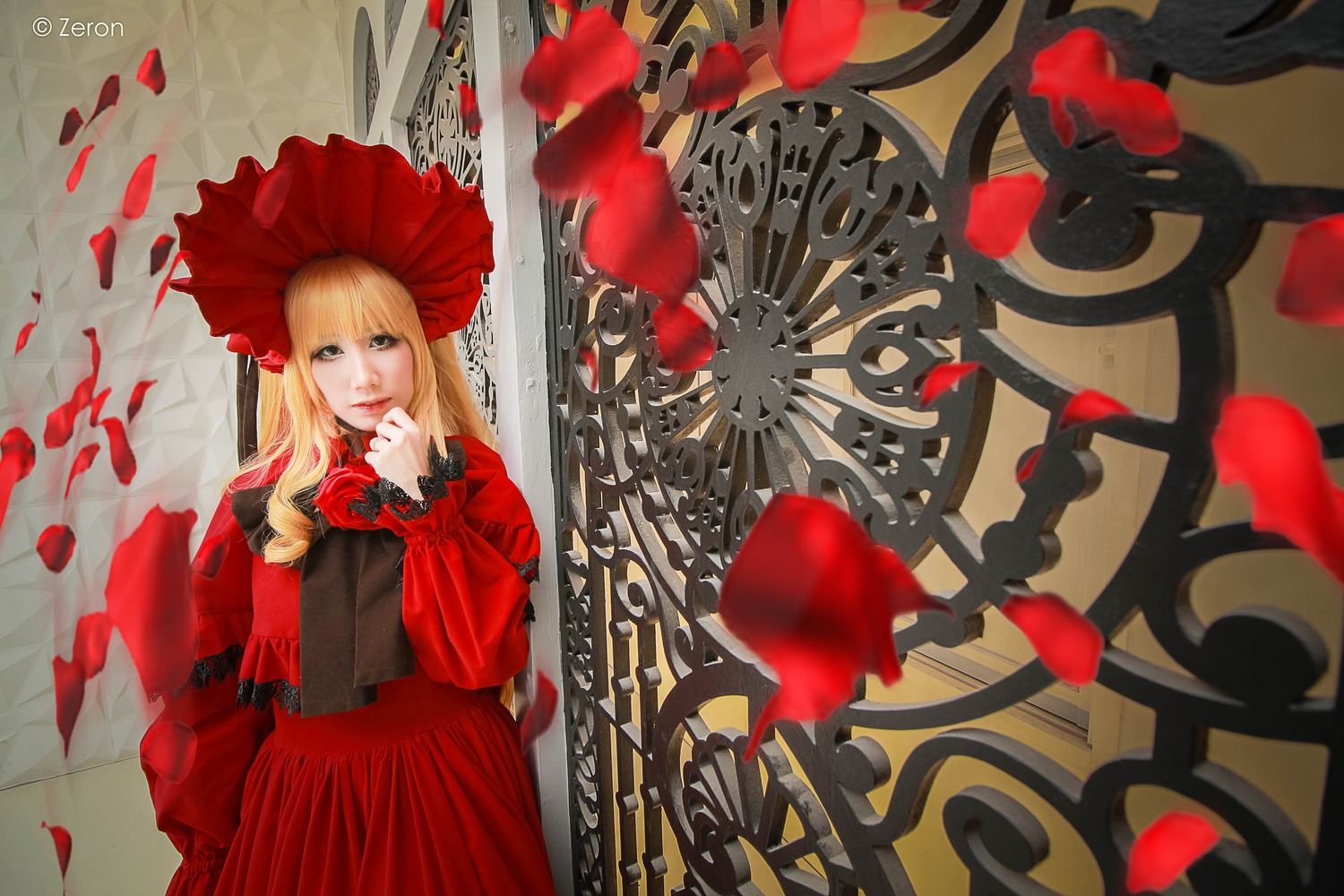 1girl blonde_hair bonnet dress flower long_hair long_sleeves looking_at_viewer petals red_dress rose_petals shinku solo