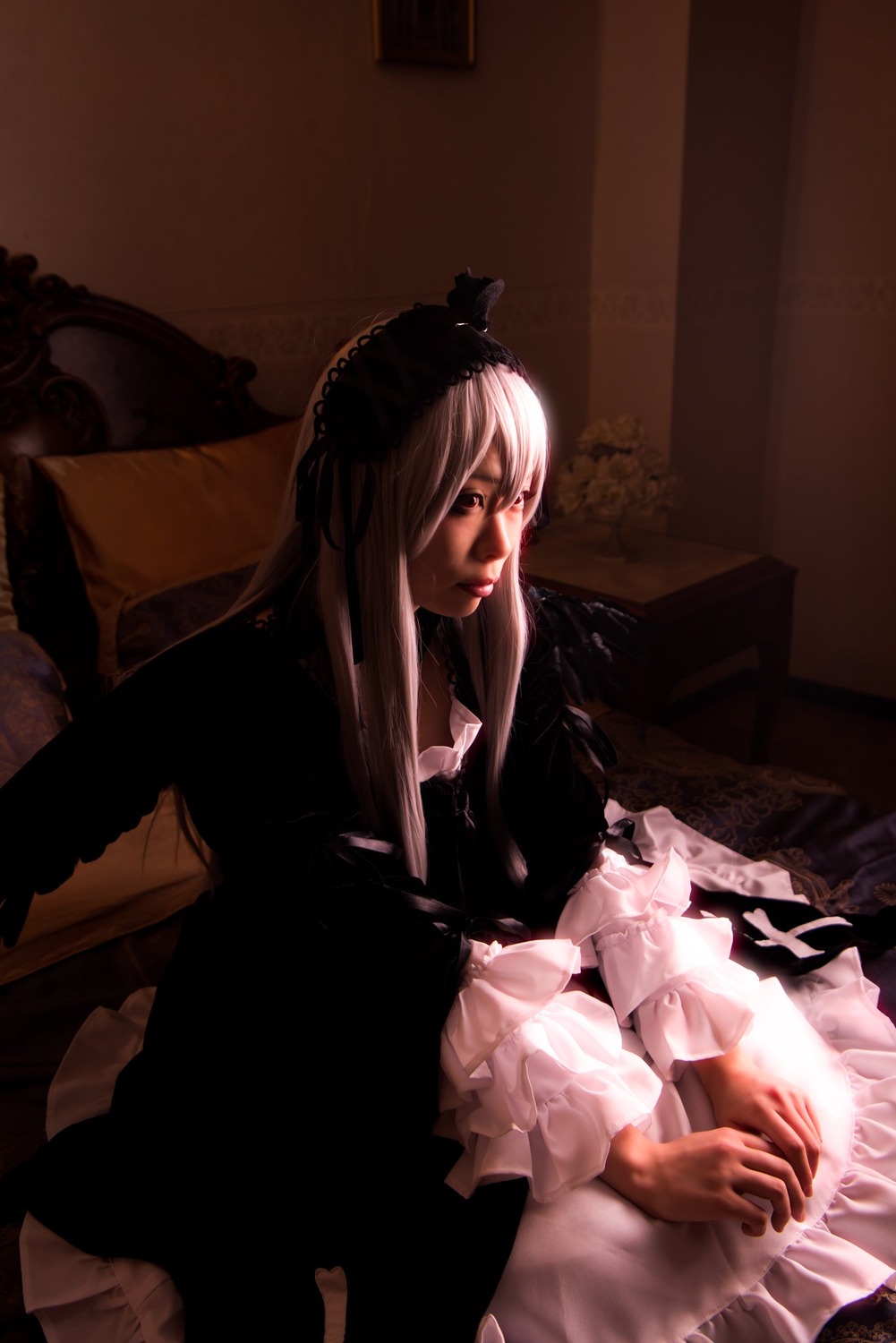 1girl chair dress frills indoors lips long_hair long_sleeves sitting solo suigintou