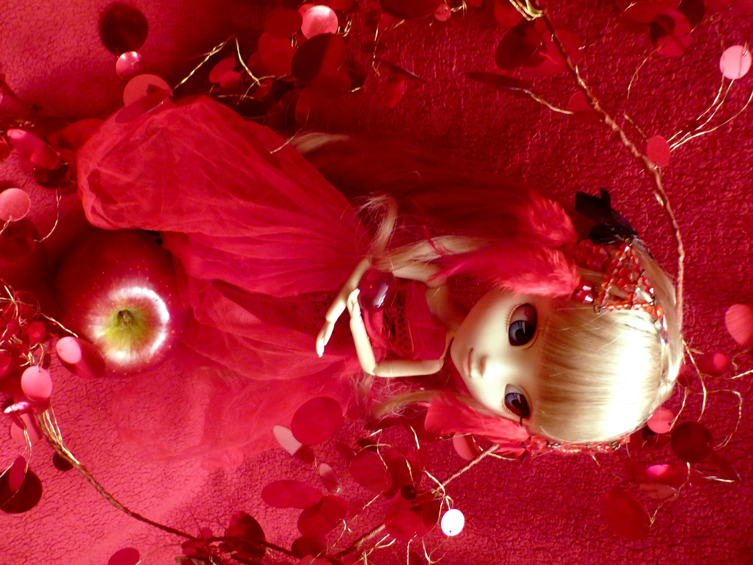 1girl apple doll dress flower food fruit long_hair looking_at_viewer pink_hair red_background red_dress red_theme shinku solo