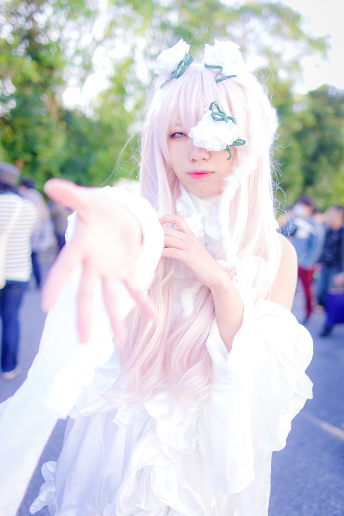 1girl blurry blurry_background blurry_foreground depth_of_field dress flower kirakishou lips long_hair looking_at_viewer solo white_hair