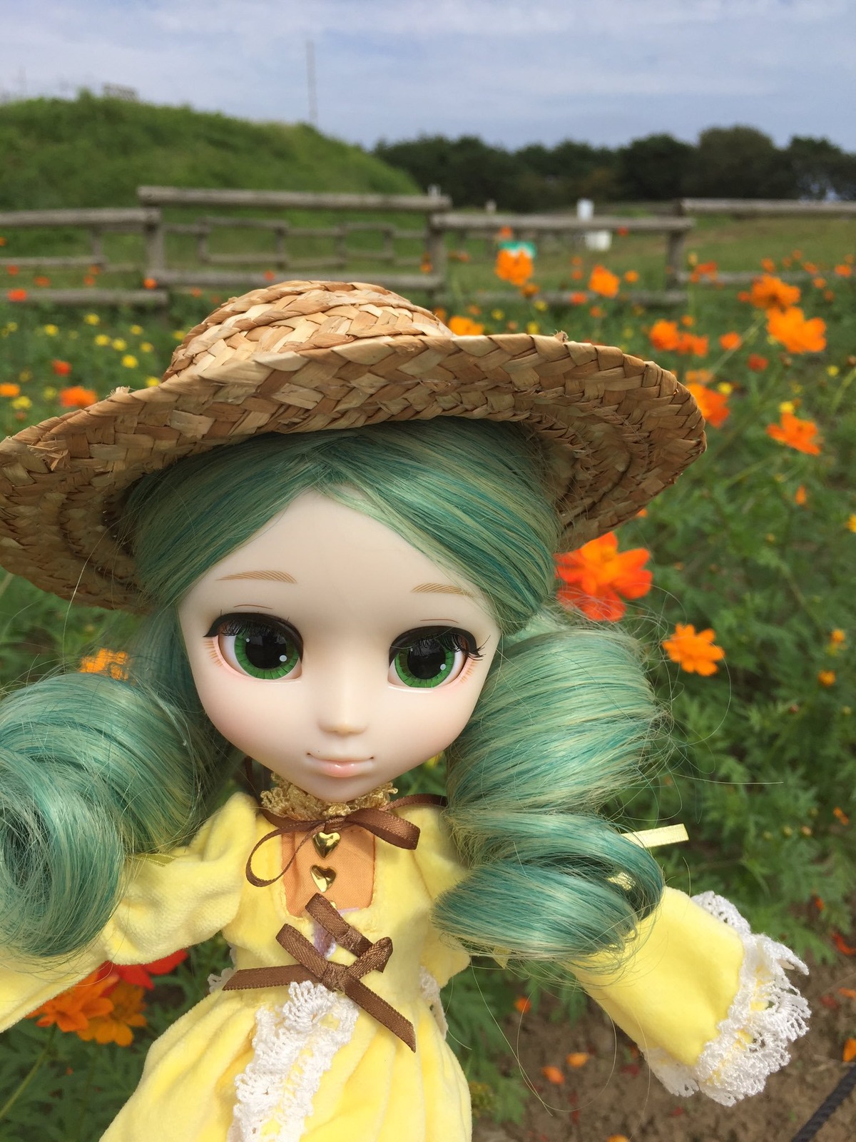 1girl day doll dress drill_hair flower green_eyes green_hair hat kanaria long_hair looking_at_viewer outdoors smile solo straw_hat twin_drills twintails