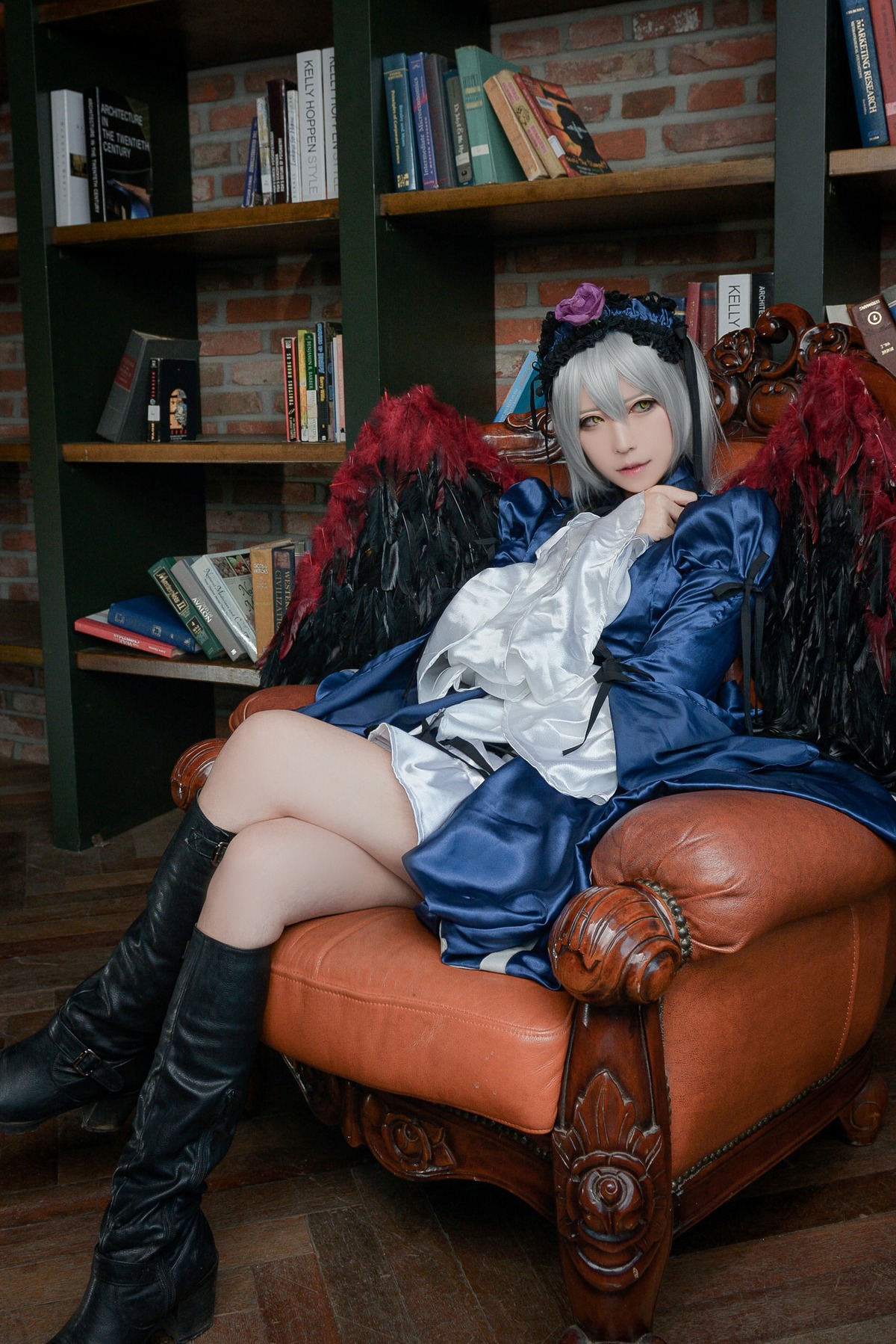 1girl book bookshelf boots crossed_legs flower hairband silver_hair sitting solo suigintou yellow_eyes