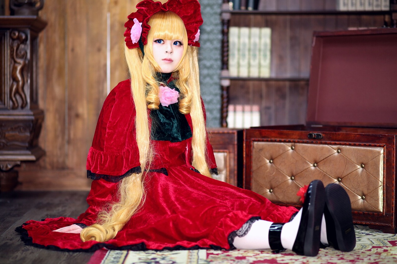 1girl blonde_hair blue_eyes blurry bow doll_joints dress flower indoors lips long_hair on_floor red_dress shinku sitting solo yokozuwari