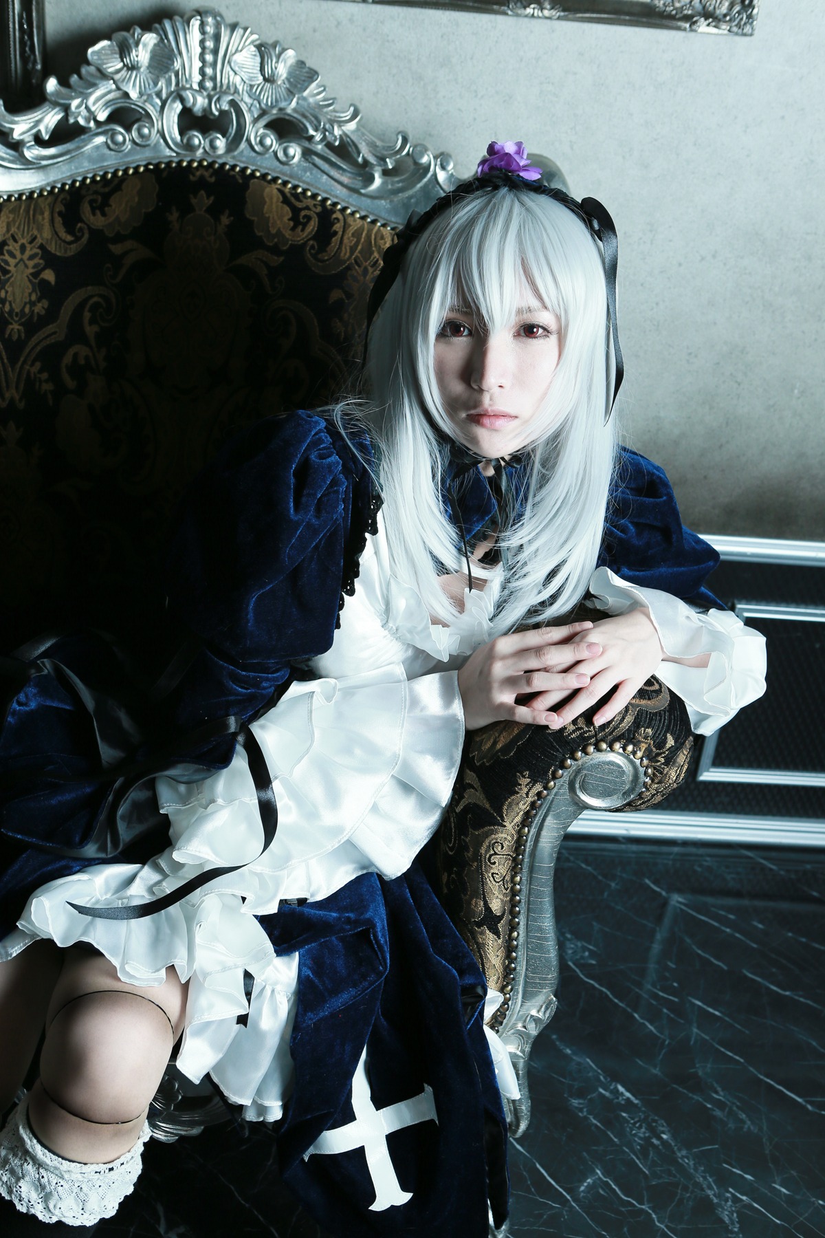 1girl dress frills gothic_lolita hairband lips lolita_fashion long_hair long_sleeves sitting solo suigintou thighhighs