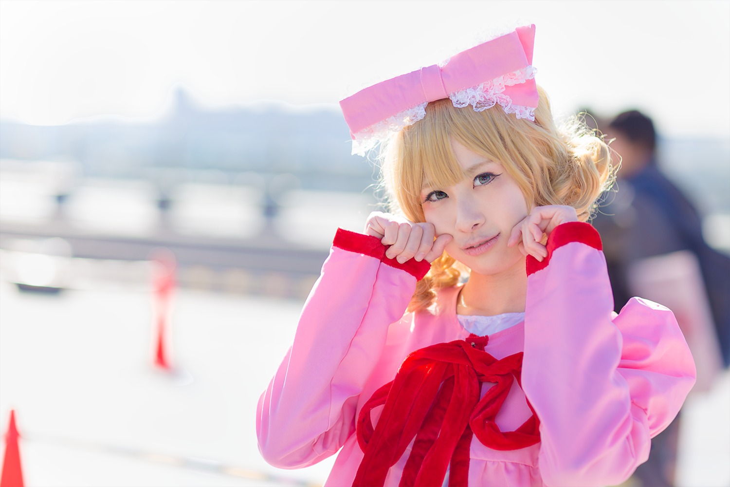 1girl bangs blonde_hair blue_eyes blurry blurry_background blurry_foreground depth_of_field hat hinaichigo lips long_sleeves looking_at_viewer motion_blur photo ribbon sleeves_past_wrists solo umbrella upper_body