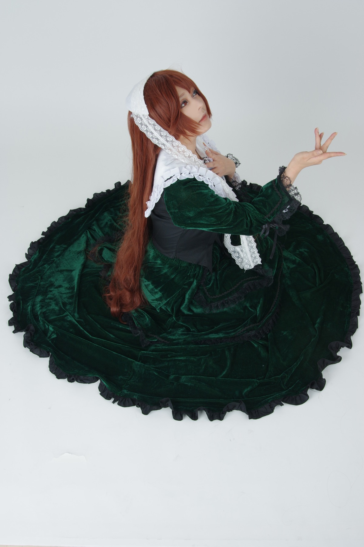 1girl brown_hair dress frills green_dress grey_background jewelry lolita_fashion long_hair long_sleeves solo suiseiseki