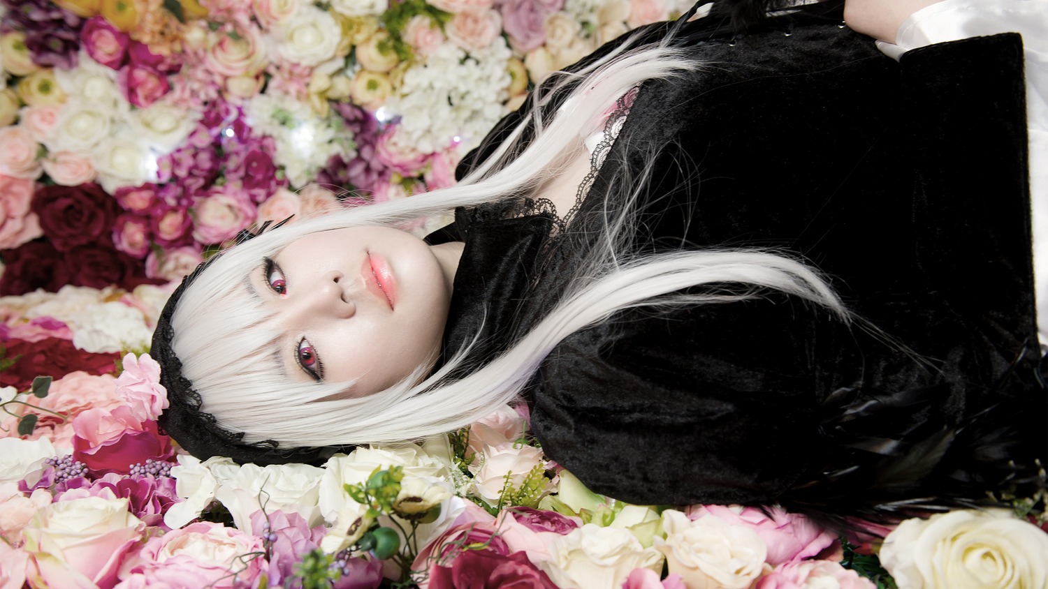 1girl bangs black_dress closed_mouth flower gothic_lolita hairband lace lips lolita_fashion long_hair looking_at_viewer pink_flower pink_rose red_eyes rose solo suigintou upper_body white_flower white_hair white_rose