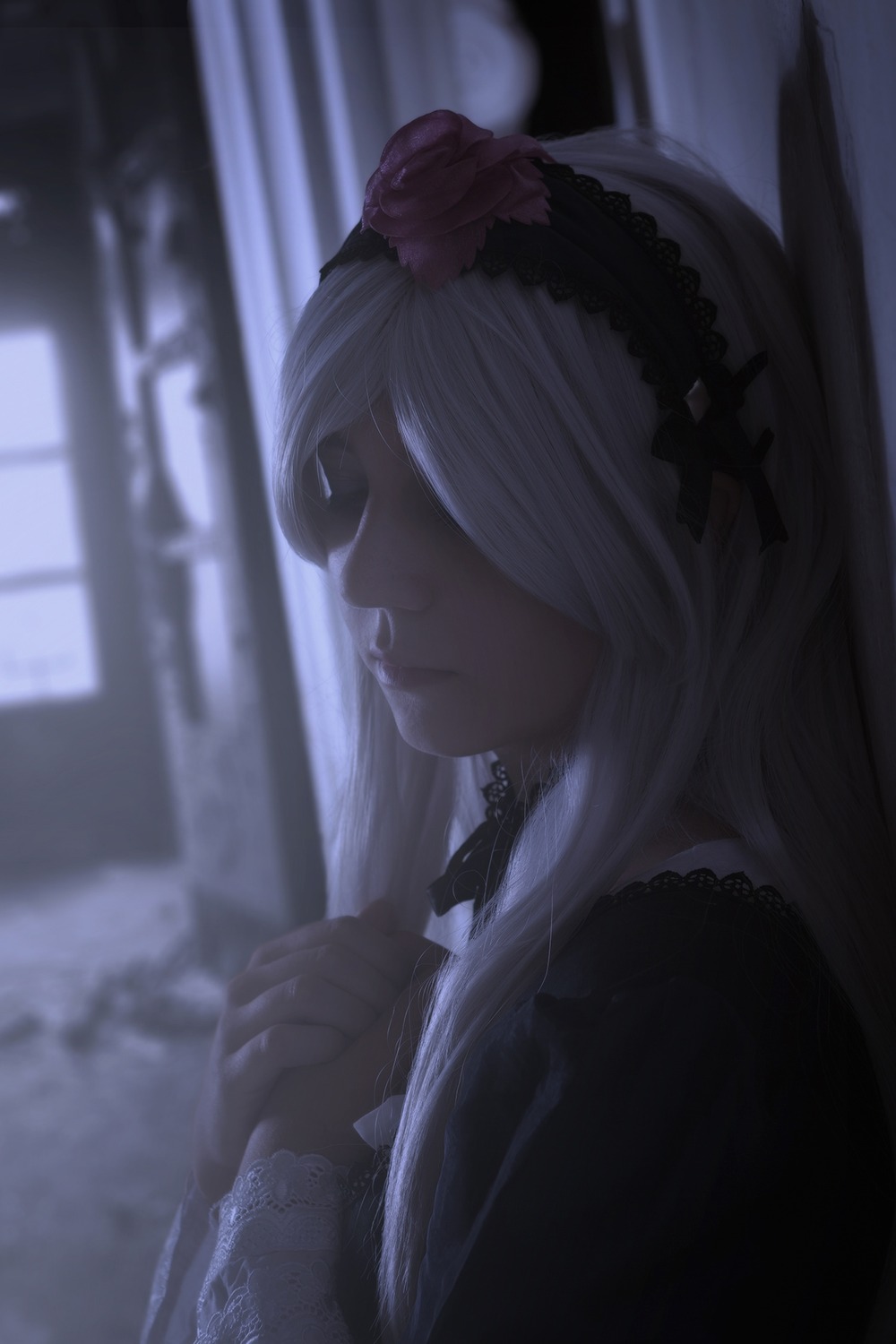 1girl blurry blurry_background choker closed_mouth dress frills from_side hair_ornament hairband indoors long_hair profile solo suigintou upper_body