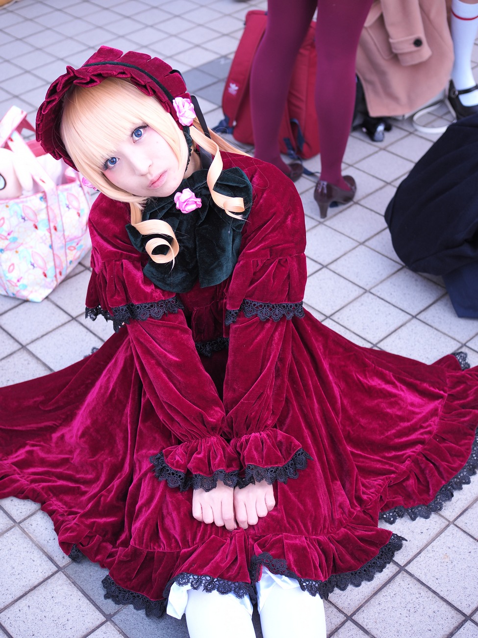 1girl blonde_hair blue_eyes bow chain-link_fence dress fence floor frills hairband lolita_fashion long_sleeves looking_at_viewer pantyhose red_dress shinku solo tile_floor tile_wall tiles