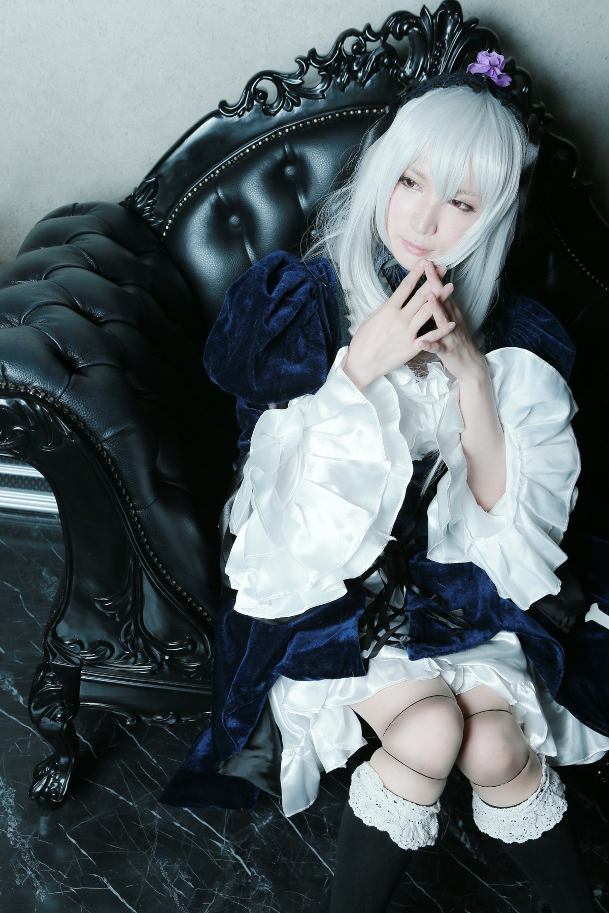 1girl boots doll_joints dress flower gothic_lolita hair_ornament lolita_fashion long_hair long_sleeves own_hands_together sitting solo suigintou white_hair