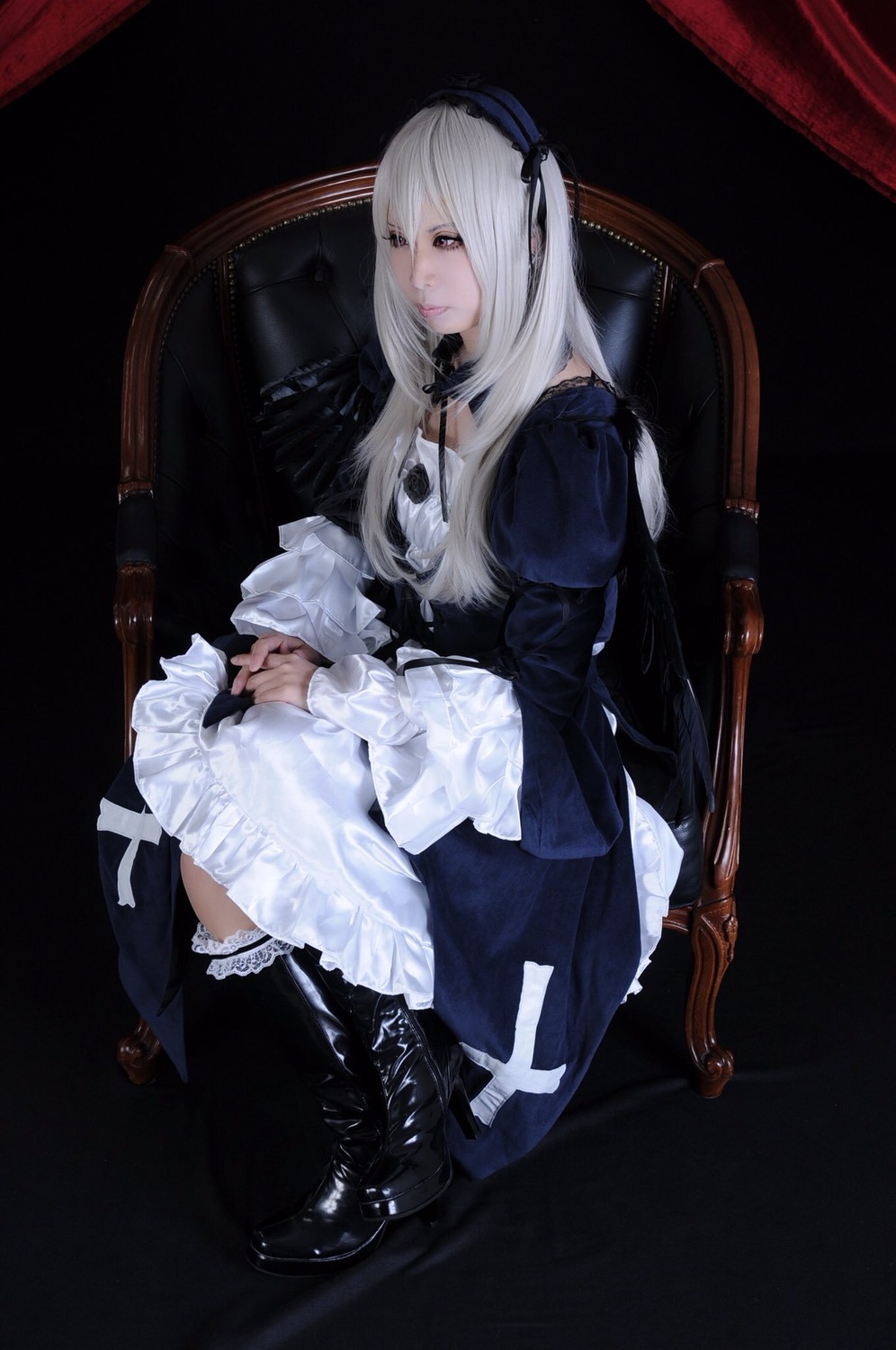 1girl black_legwear chair dress lace lips long_hair long_sleeves looking_at_viewer puffy_sleeves sitting solo suigintou thighhighs